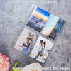 A set of inner soft photocard sleeves displayed on a gray surface, showing various colorful and scenic designs.