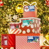 A stack of red and white Christmas gift boxes decorated with festive tags and wrapped in sparkling green tinsel.