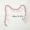 A black floral garland with pink sakura flowers is displayed against a white background.