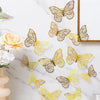 A set of three 3D gold butterfly wall decor pieces displayed on a white marble surface.