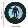Black iron-on patch featuring a silhouette of Bigfoot in light blue embroidery.