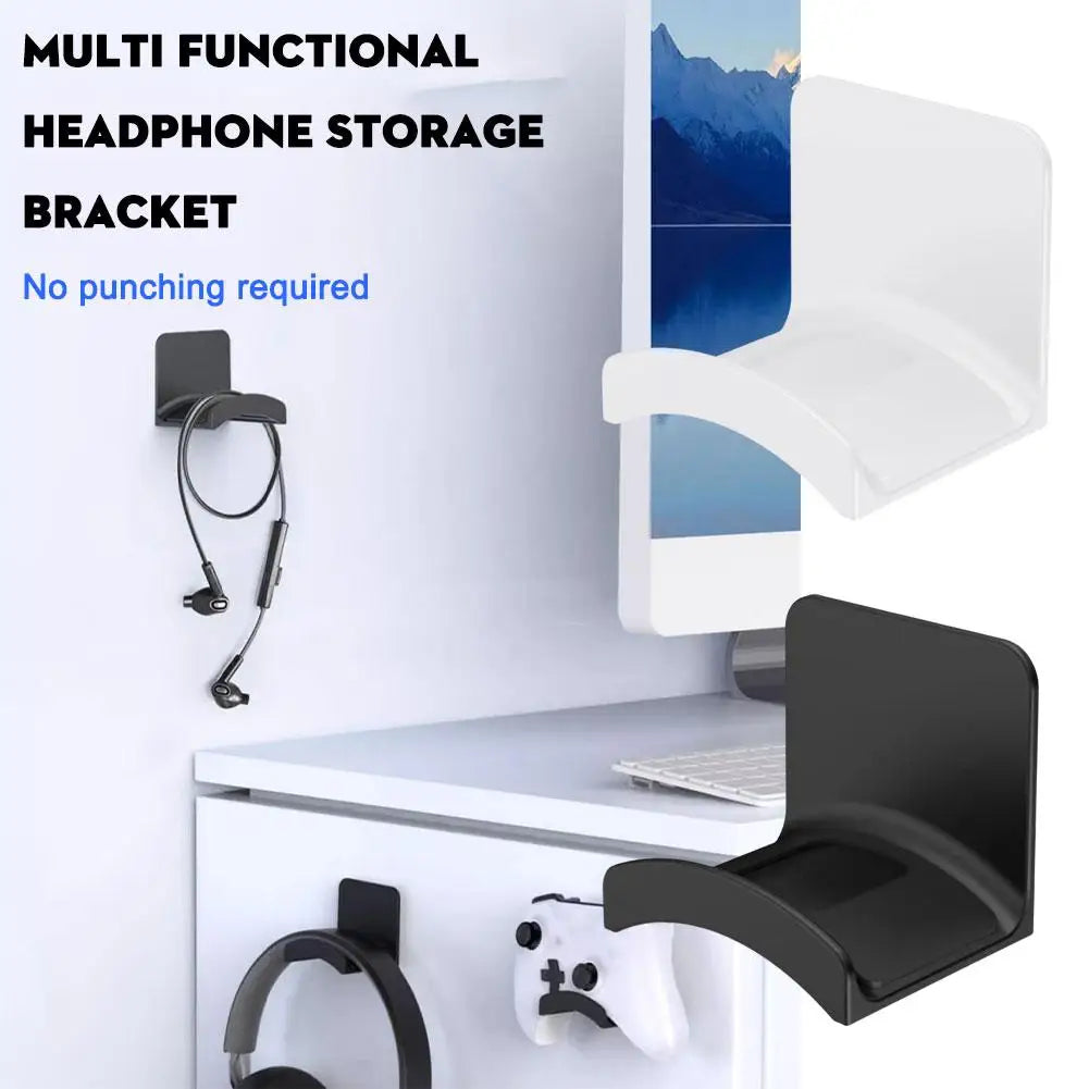 A black multi-functional headphone storage bracket mounted on a white wall, showing its use for hanging headphones.