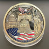 A round collectible coin featuring a statue of Liberty, an eagle, and a bell, commemorating the United States 250th anniversa