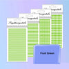 A stack of clear packaging for colorful self-adhesive rhinestone embellishments in various shades of green.