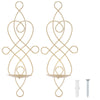 A set of decorative iron wall candle sconces featuring an intertwined, organic design.