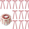A set of red and white gingham ribbon bow cake toppers in various styles and sizes.