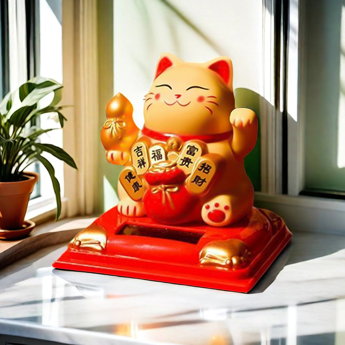 A bright orange solar-powered figurine of a waving lucky cat sitting on a red base.