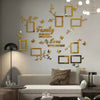 A modern living room wall decorated with gold acrylic photo frames and floral decals.