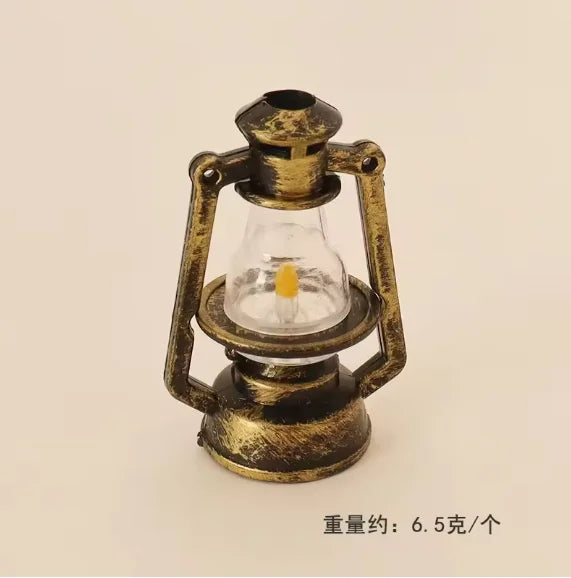 Vintage ceramic miniature lantern with a glass bulb and brass frame for dollhouse décor