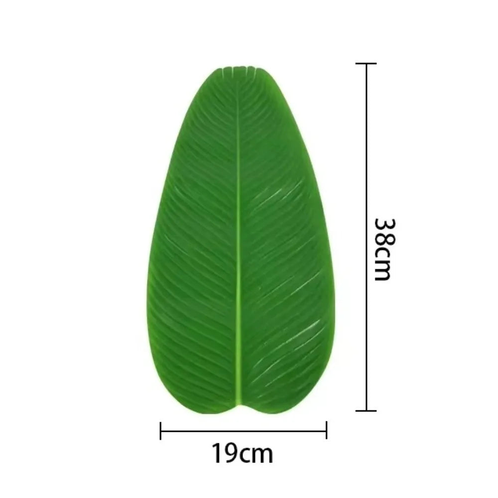 A single vibrant green tropical banana leaf used as a coaster or table protector.