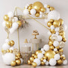 A balloon garland featuring white and gold latex balloons with confetti accents arranged in an arch shape.