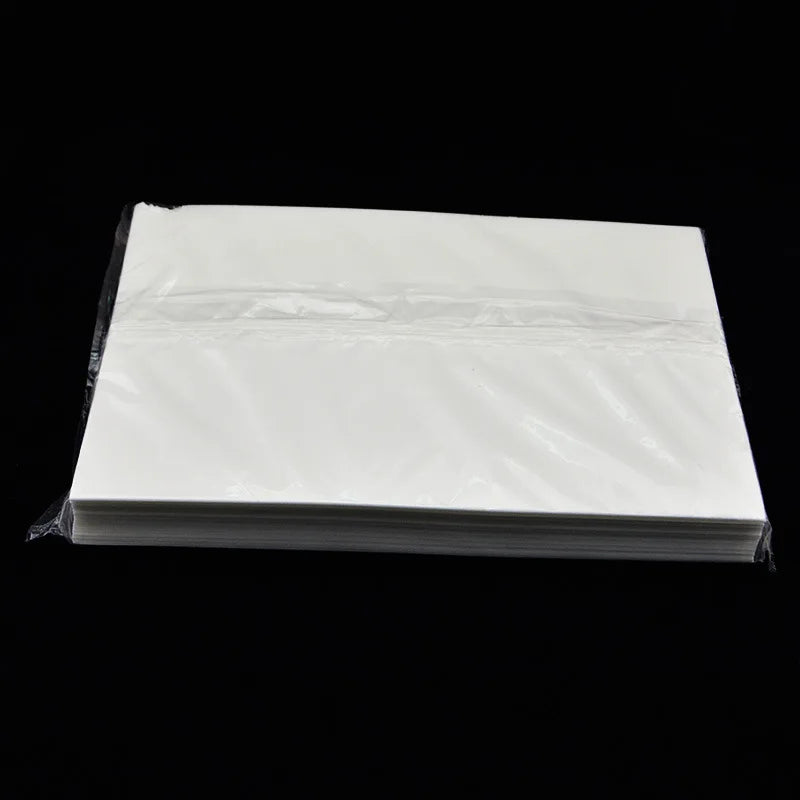 A stack of 50 sheets of white A4 edible wafer paper for cake decorating.