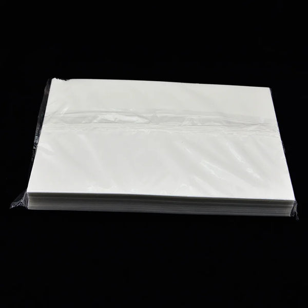 A stack of 50 sheets of white A4 edible wafer paper for cake decorating.