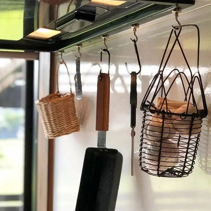 A collection of ten strong magnetic hooks hanging from a shelf for organization.