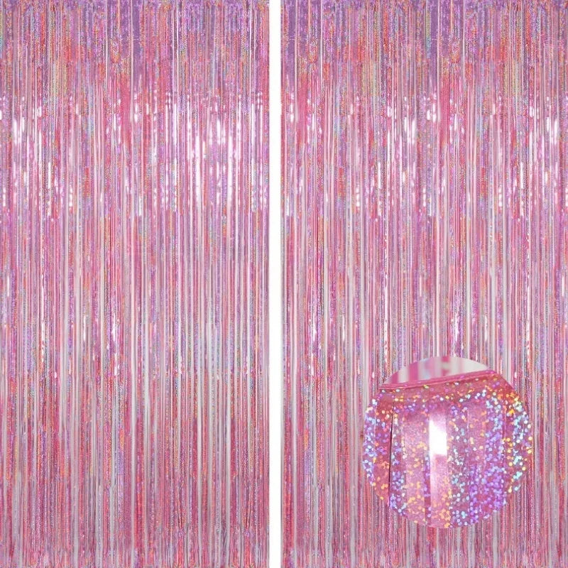 A vertical backdrop made of shimmering pink and iridescent metallic foil tinsel fringe.