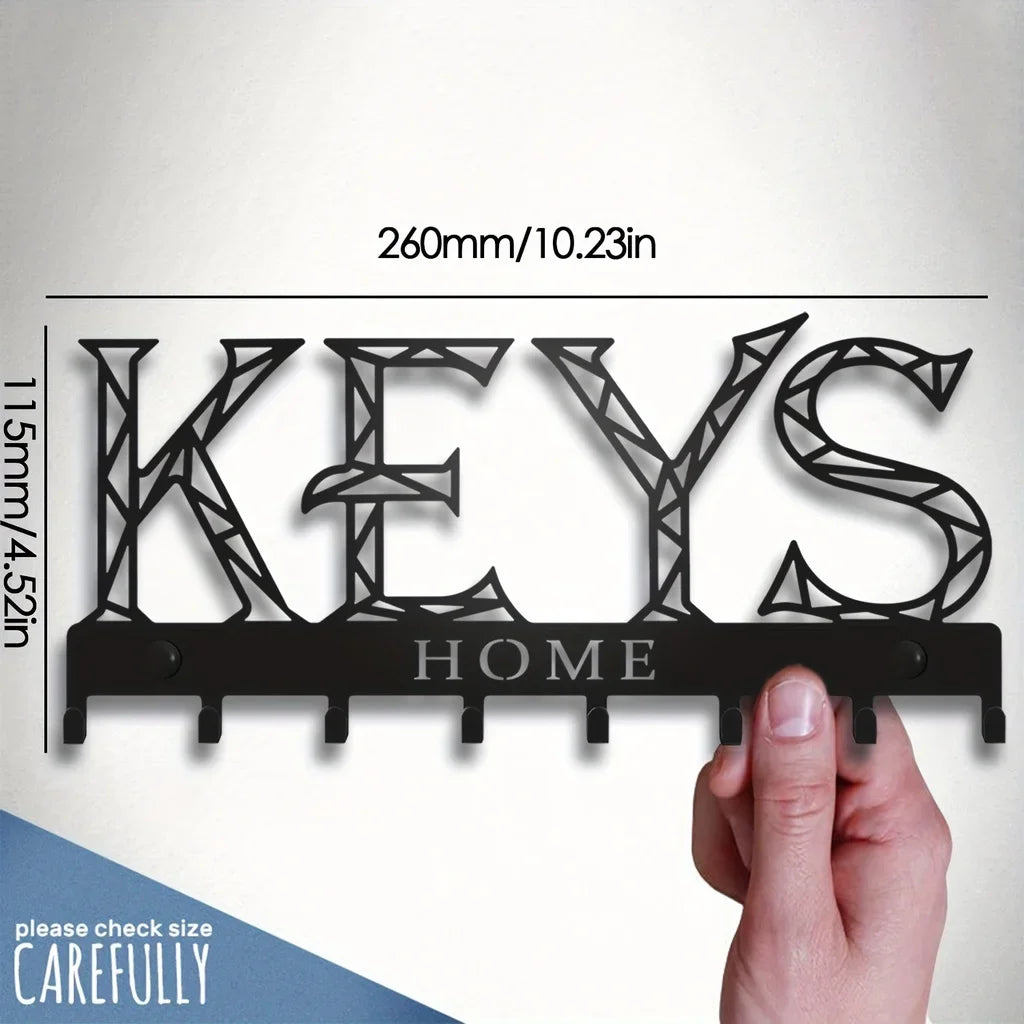 A black metal key holder with seven hooks is shown against a white background, demonstrating its size.