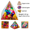A pyramid made of colored agates and gold foil with a copper screw, used for Reiki and meditation.