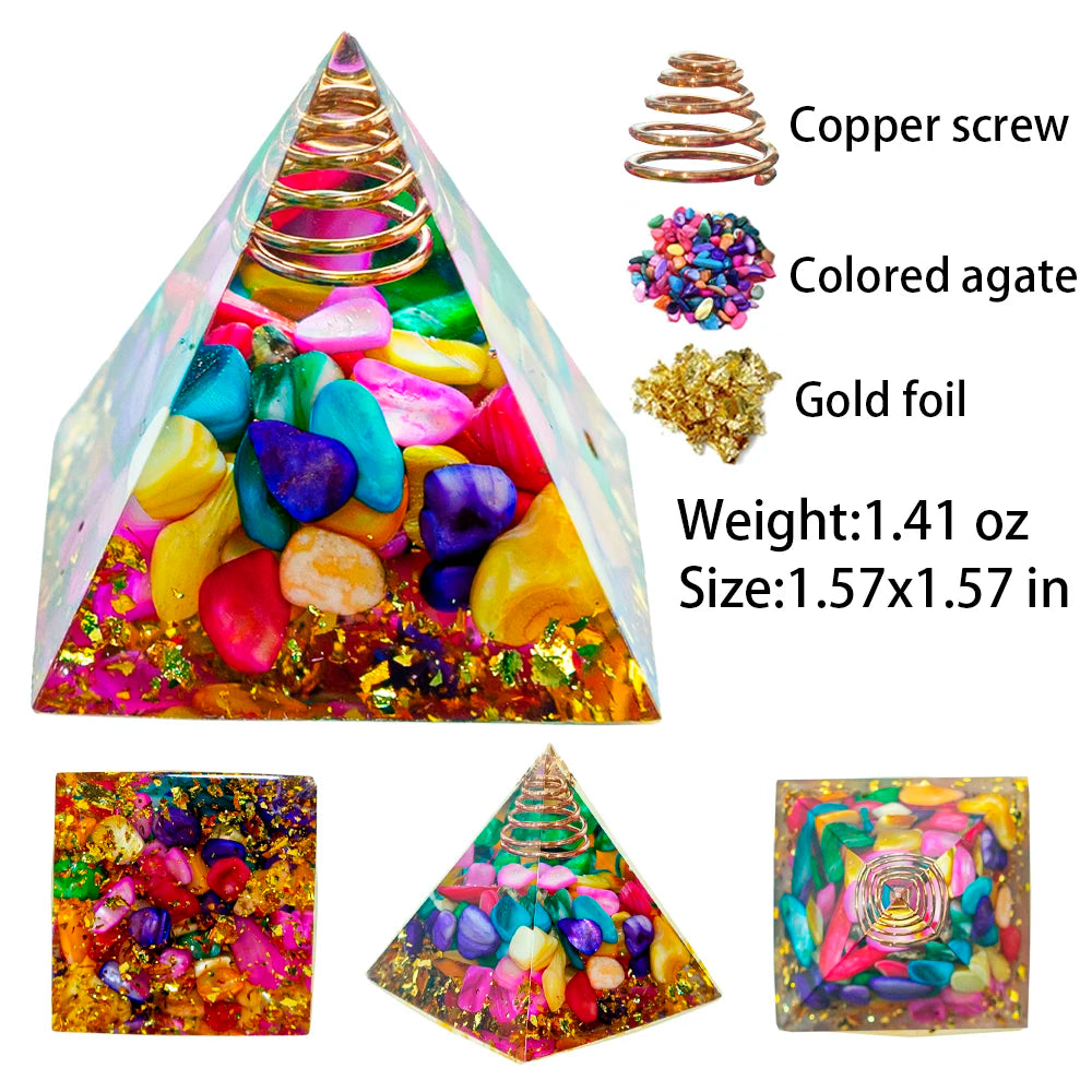 A pyramid made of colored agates and gold foil with a copper screw, used for Reiki and meditation.