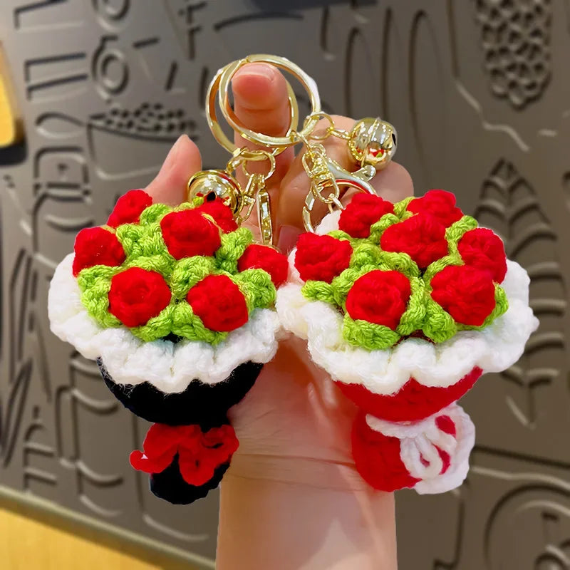 Handmade crochet flower bouquet keychain featuring red and green flowers on a white background