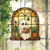 A white ghost figure holding an open book is displayed in a wooden window frame decorated with green plants and butterflies.