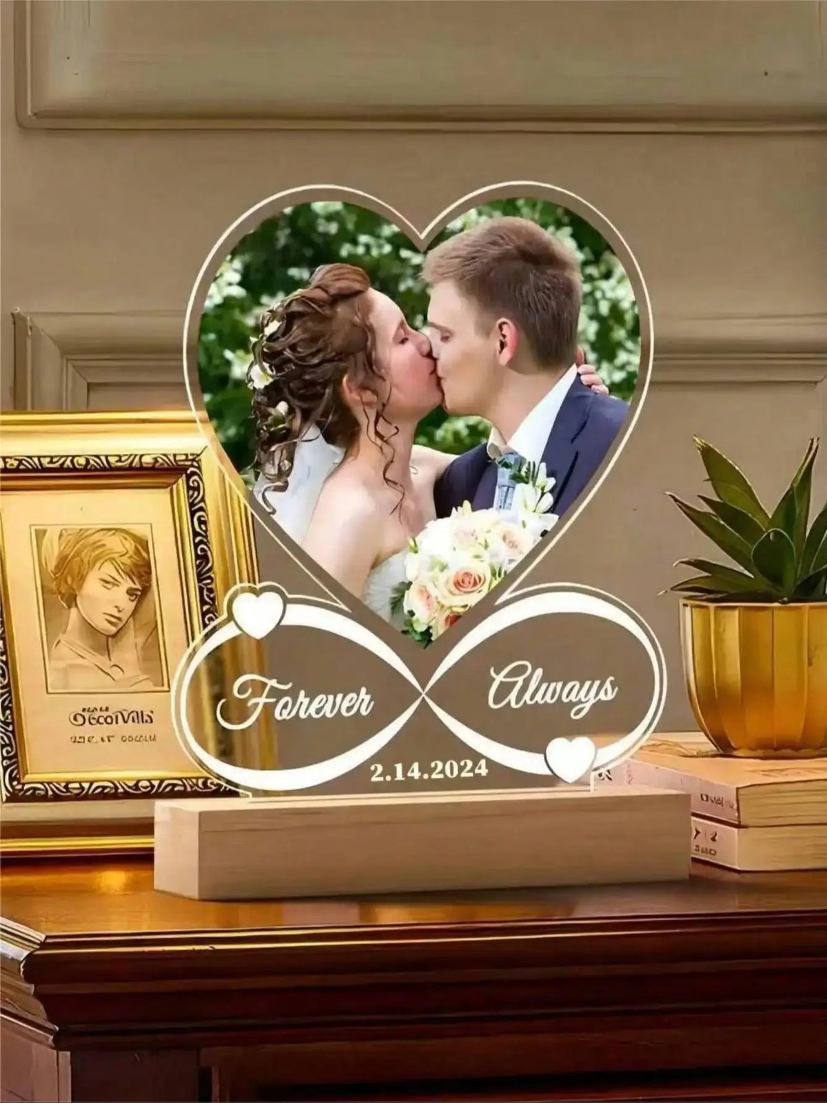 A custom acrylic heart photo frame featuring a couple kissing, set on a wooden surface.