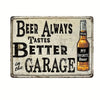 A vintage metal tin sign with distressed paint that reads Beer Always Tastes Better in the Garage and features a bottle of be