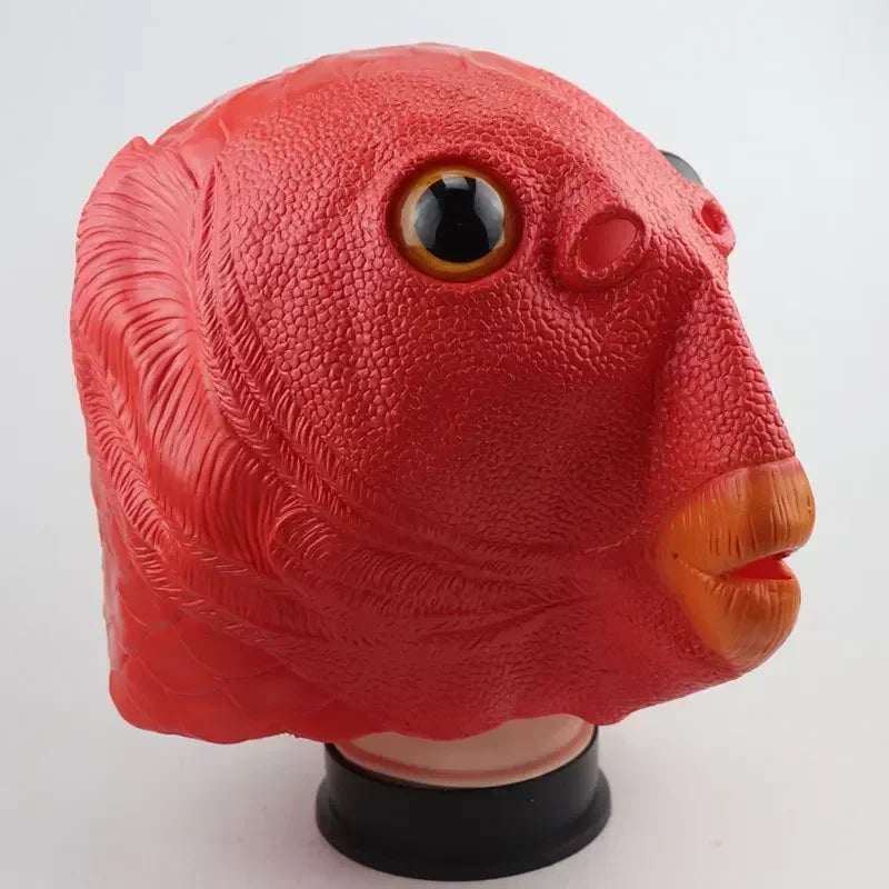 A realistic horror mask shaped like a bird head in red with a black eye and orange beak.