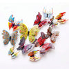 A set of twelve colorful 3D magnetic butterfly wall decor pieces.