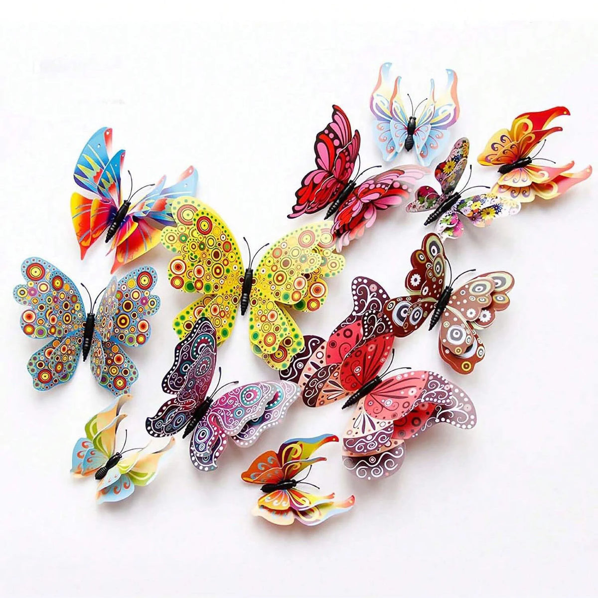 A set of twelve colorful 3D magnetic butterfly wall decor pieces.