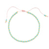 Handmade boho glass bead bracelet with adjustable cord featuring light blue beads and pink cord.