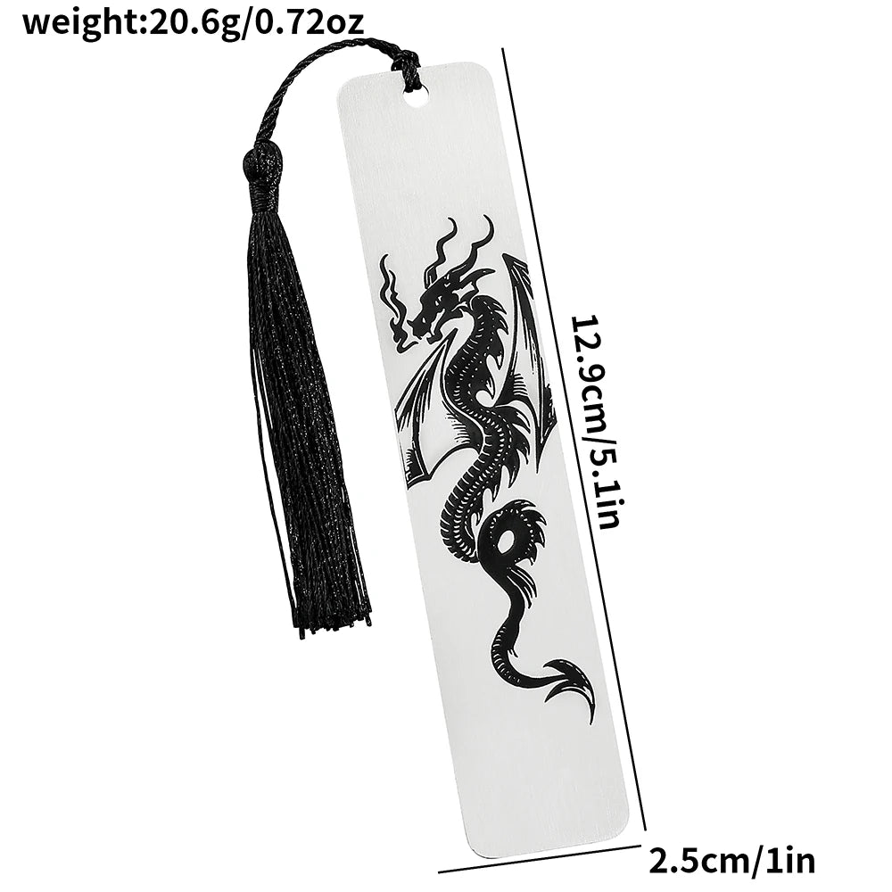 A white tag with a black dragon design is attached to a tassel, used as an elegant reading accessory.