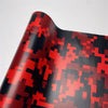 A close-up of a color-changing digital camouflage vinyl wrap film showing red and black patterns.