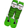 A pair of novelty crew socks featuring a cartoon face print with green stripes and black accents.