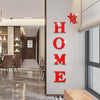 Red acrylic wall stickers shaped like a butterfly spelling out the word HOME on a light gray wall.