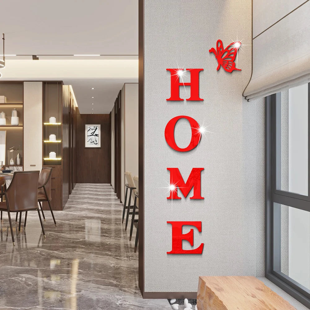 Red acrylic wall stickers shaped like a butterfly spelling out the word HOME on a light gray wall.