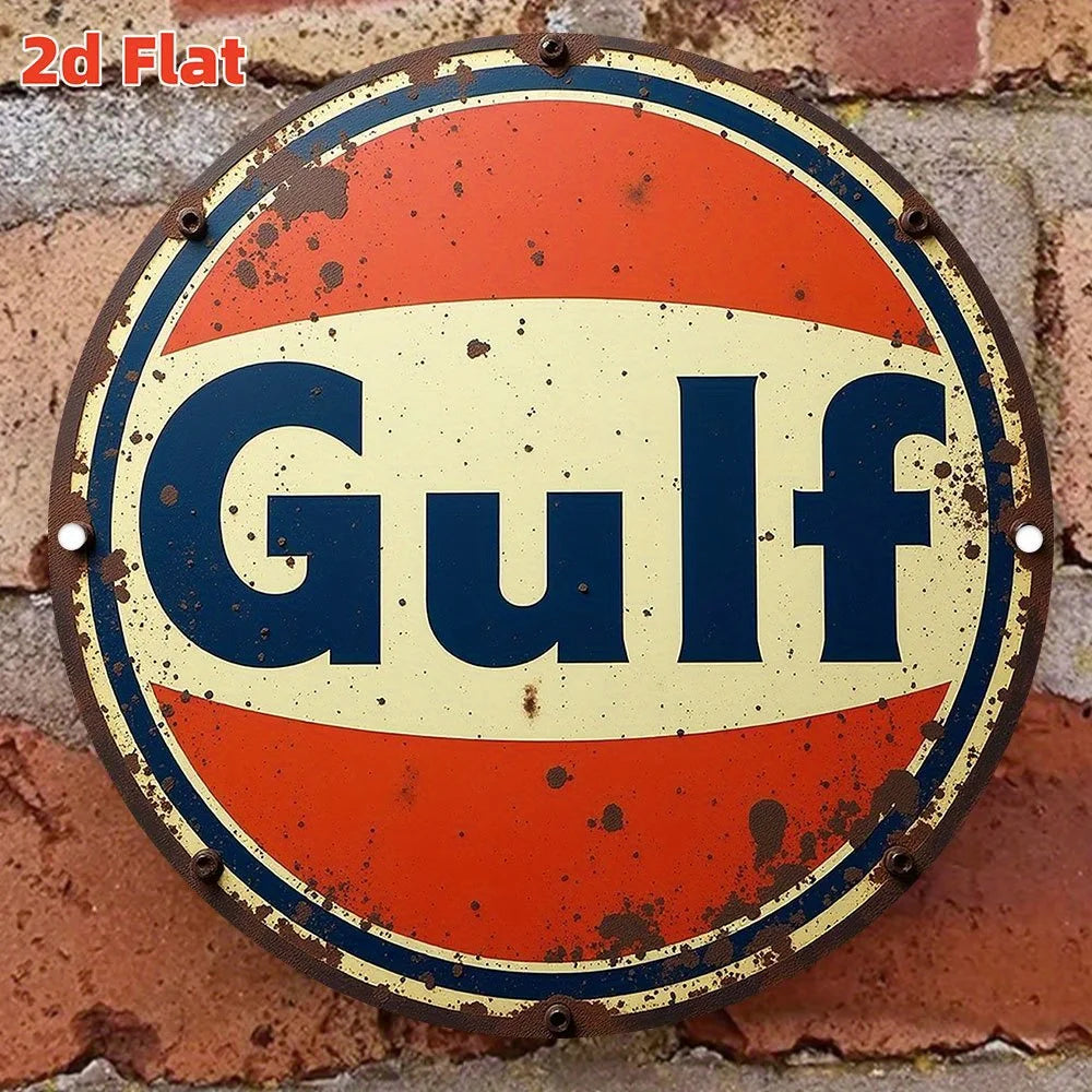 Vintage round metal sign with an orange and yellow background featuring the word Gulf in dark blue text.