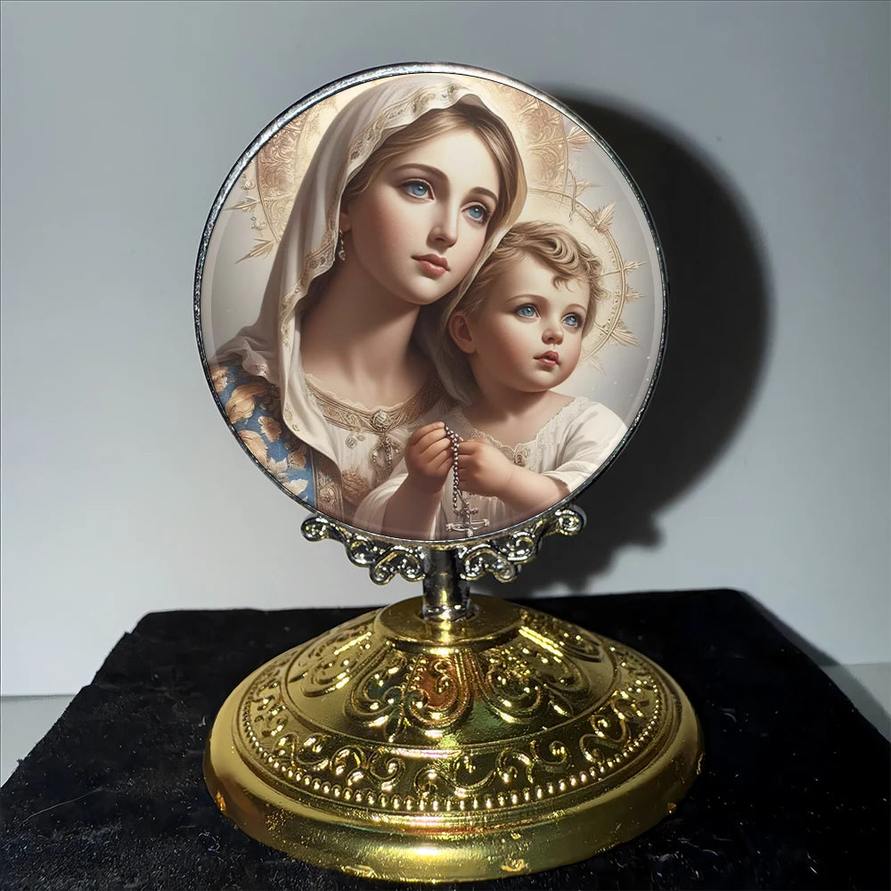 A vintage silver-framed religious ornament featuring a depiction of the Virgin Mary and the Christ Child.