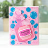 A pink and blue polka dot card featuring a purple glass bottle labeled Amortentia I'm enchanted by you