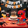 A red birthday sign shaped like the number 3 with a spider theme, set on a table decorated with spiders and birthday banners.