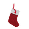 A red knitted sock with a white cuff featuring a red letter X and a hanging loop for tree decoration.