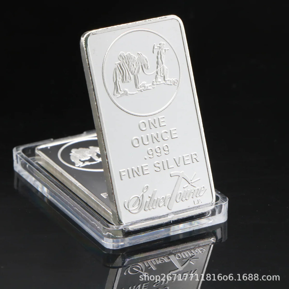 A silver bullion bar replica showing an elephant and a standing figure design.