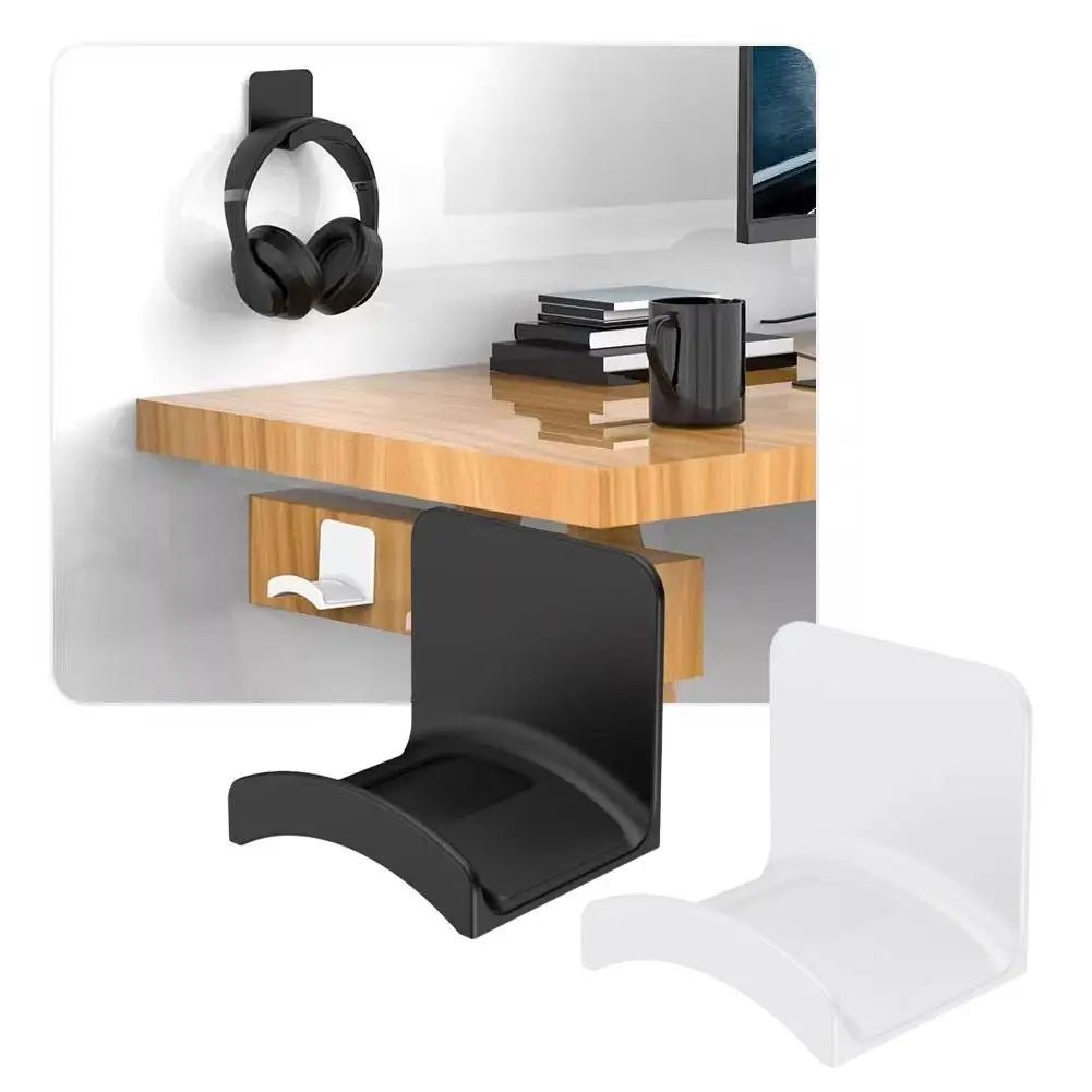 A black universal wall-mounted headphone holder and hanger displayed next to a wooden desk.
