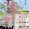 A pink and beige balloon garland arch kit featuring various sized balloons for a baby shower decoration.