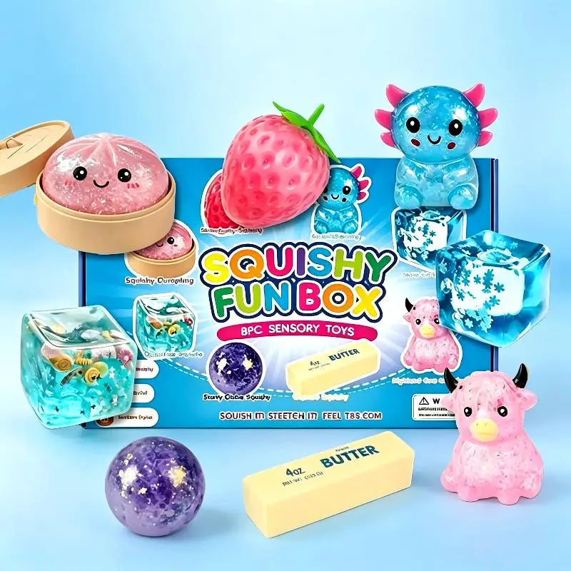 A box of squishy fun box sensory toys featuring a strawberry, a blue creature, and butter blocks.