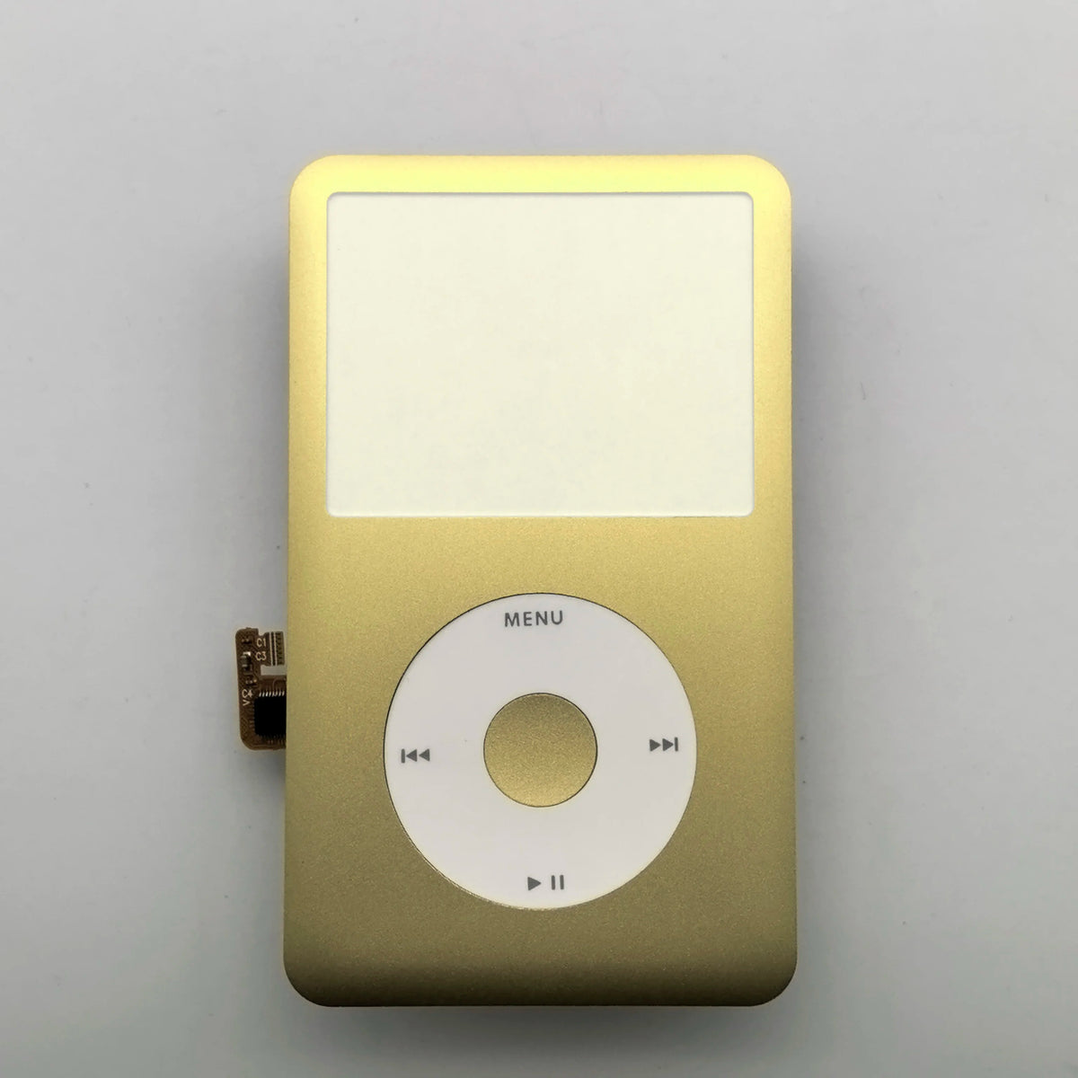 A gold-colored iPod with a blank white front faceplate and clickwheel assembly.