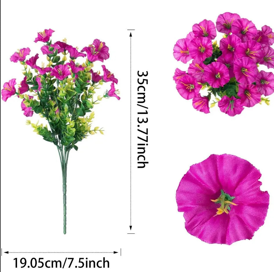 A vibrant bouquet of pink and magenta artificial flowers with green stems shown in full bloom and close-up detail.