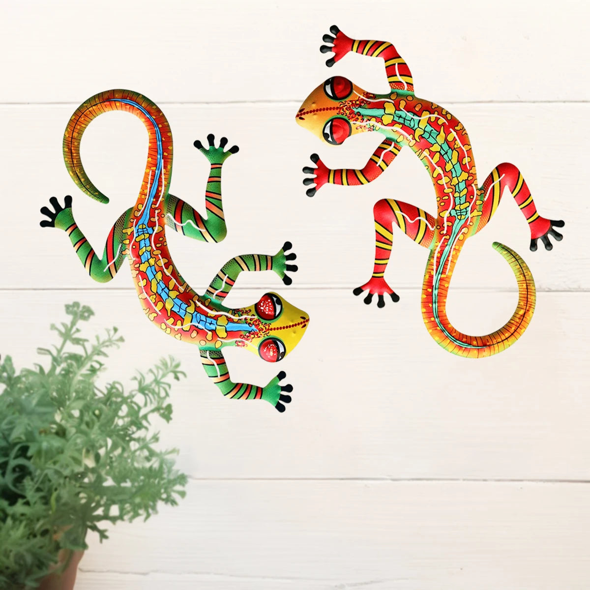 Handcrafted metal gecko wall art featuring vibrant orange and green colors