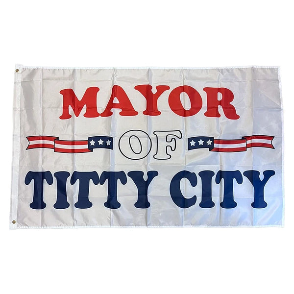 Una pancarta blanca colgante con texto rojo y azul que dice ALCALDE DE TITTY CITY