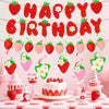 A strawberry birthday party decoration set featuring a banner, cake toppers, and a strawberry cake.