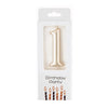 A gold number candle shaped like the number one for birthday party decor.